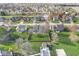 Aerial view of a neighborhood showcasing well-manicured lawns, mature trees, and a fenced backyard at 1417 Macintosh Ct, Avon, IN 46123