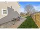 Backyard with a concrete path leading to a fire pit with outdoor seating and a privacy fence at 1417 Macintosh Ct, Avon, IN 46123