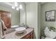 Bathroom features a granite countertop, vessel sink, and wood cabinets at 1417 Macintosh Ct, Avon, IN 46123