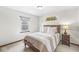 Comfortable bedroom featuring a large window, plush bedding, and a matching nightstand and lamps at 1417 Macintosh Ct, Avon, IN 46123