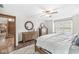 Spacious bedroom with hardwood floors, decorative mirror, and a window seat that fills the room with natural light at 1417 Macintosh Ct, Avon, IN 46123