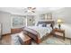 Cozy bedroom features a window seat, ceiling fan, and wooden accents for a warm and inviting atmosphere at 1417 Macintosh Ct, Avon, IN 46123