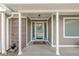 Inviting front entrance with a decorative storm door and a neutral color scheme at 1417 Macintosh Ct, Avon, IN 46123