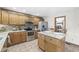 Kitchen features stainless steel appliances and an island with a breakfast table at 1417 Macintosh Ct, Avon, IN 46123