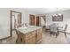 Kitchen island with granite countertops with dining area at 1417 Macintosh Ct, Avon, IN 46123