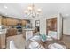 Kitchen featuring stainless steel appliances and an island with a breakfast table at 1417 Macintosh Ct, Avon, IN 46123