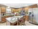 Kitchen features stainless steel appliances, granite countertops, and tile floors at 1417 Macintosh Ct, Avon, IN 46123