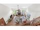 Spacious living room features soaring ceilings, a brick fireplace, plush seating, and a ceiling fan at 1417 Macintosh Ct, Avon, IN 46123