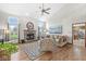 Bright living room with a fireplace, hardwood floors, and large windows at 1417 Macintosh Ct, Avon, IN 46123