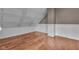Bright bedroom with vaulted ceilings, crown molding, and wood floors at 143 W Washington St, Mooresville, IN 46158