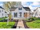 Charming two-story home with a well-maintained front yard and inviting entrance, perfect for a cozy Gathering residence at 143 W Washington St, Mooresville, IN 46158