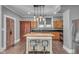 Cozy kitchen featuring modern appliances, ample storage, a central island, and barstool seating at 143 W Washington St, Mooresville, IN 46158