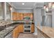 Functional kitchen with stainless steel appliances, an island, modern lighting, and stylish backsplash at 143 W Washington St, Mooresville, IN 46158