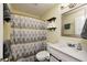 Bright bathroom with a new vanity, chrome faucet, updated lighting, and a shower-tub combo at 1508 Douglas Dr, Franklin, IN 46131
