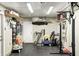 Finished garage with storage shelves, workout equipment, and plenty of space for parking at 1508 Douglas Dr, Franklin, IN 46131