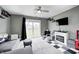 Inviting living room features plush gray carpet, a modern ceiling fan, and sliding glass doors to the backyard at 1508 Douglas Dr, Franklin, IN 46131
