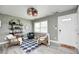 Bright living room featuring a decorative ceiling fan, wood-look floors, and a cozy seating area at 1508 Douglas Dr, Franklin, IN 46131