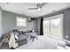 Comfortable living room featuring gray sectional, gray carpet, and sliding glass doors leading to the backyard at 1508 Douglas Dr, Franklin, IN 46131