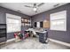Bright office space with two large windows, a neutral carpet, and a modern ceiling fan at 1508 Douglas Dr, Franklin, IN 46131