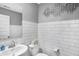 Modern half bath featuring subway tile, white fixtures, and stylish decor at 15379 Alperton Rd, Fishers, IN 46037