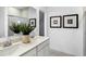 Modern bathroom featuring double sinks and decorative wall art at 15379 Alperton Rd, Fishers, IN 46037