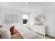 A cozy bedroom showcasing a shiplap wall, playful wall decor, and a bright window with neighborhood view at 15379 Alperton Rd, Fishers, IN 46037