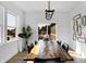 Well-lit dining room with a view of the neighborhood, ideal for gatherings at 15379 Alperton Rd, Fishers, IN 46037