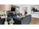 Comfortable living room with stylish decor, wood accent wall, and view of the outdoors at 15379 Alperton Rd, Fishers, IN 46037
