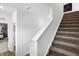 Carpeted staircase with white walls leads to the upper level of this modern home at 15379 Alperton Rd, Fishers, IN 46037