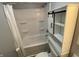 Bright bathroom featuring a shower-tub combo and stylish sliding door cabinet at 1546 Kappes St, Indianapolis, IN 46221