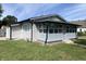 Charming single-story home featuring vinyl siding, a well-maintained lawn and a covered porch with ample windows at 1546 Kappes St, Indianapolis, IN 46221