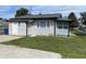 Curb view of a home featuring a well-kept lawn and classic siding at 1546 Kappes St, Indianapolis, IN 46221
