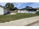 Attractive home exterior with a well-manicured lawn, driveway, and cozy front porch at 1546 Kappes St, Indianapolis, IN 46221
