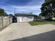 Charming home exterior with well-maintained yard, ample parking, and inviting entrance at 1546 Kappes St, Indianapolis, IN 46221