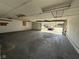 Unfinished garage with concrete floor and unfinished ceiling at 1546 Kappes St, Indianapolis, IN 46221