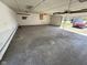 Unfinished garage with concrete floor and unfinished ceiling at 1546 Kappes St, Indianapolis, IN 46221