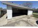 Spacious detached garage featuring an open overhead door and a concrete driveway at 1546 Kappes St, Indianapolis, IN 46221