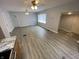 Spacious living area features wood-look flooring, neutral paint, and ample natural light at 1546 Kappes St, Indianapolis, IN 46221
