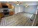 Open-concept living room features wooden floors, neutral paint, and ceiling fans with lights at 1546 Kappes St, Indianapolis, IN 46221