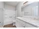 Clean bathroom features a tub/shower combination and a vanity with white cabinets and countertop at 1616 Capra Ct, Beech Grove, IN 46107