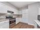 Bright kitchen with white cabinets, stainless steel appliances, and granite countertops provides a welcoming atmosphere at 1616 Capra Ct, Beech Grove, IN 46107