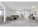 Inviting living room boasts neutral decor, an open layout, and a sliding glass door for natural light at 1616 Capra Ct, Beech Grove, IN 46107