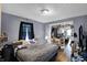 This primary bedroom includes a doorway to the kitchen and an adjoined sitting room with hardwood floors at 1719 Dawson St, Indianapolis, IN 46203
