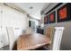 Cozy dining area with a wooden table, four chairs, and stylish wall art at 1720 Justin Ct, Indianapolis, IN 46219