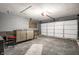 Spacious garage with a textured floor, garage door, and counter/storage area at 1720 Justin Ct, Indianapolis, IN 46219