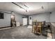 Garage with a finished floor, storage, a white refrigerator, and exterior access at 1720 Justin Ct, Indianapolis, IN 46219