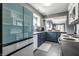 Well-lit kitchen with stainless steel appliances, dark countertops, and gray tile flooring at 1720 Justin Ct, Indianapolis, IN 46219