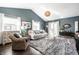 Bright living room with vaulted ceilings, a modern rug, and ample natural light at 1720 Justin Ct, Indianapolis, IN 46219