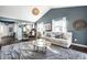 Open-concept living room with cozy seating, modern decor, and seamless kitchen access at 1720 Justin Ct, Indianapolis, IN 46219