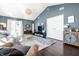 Well-lit living room with modern decor, comfortable seating, and access to the outdoors at 1720 Justin Ct, Indianapolis, IN 46219